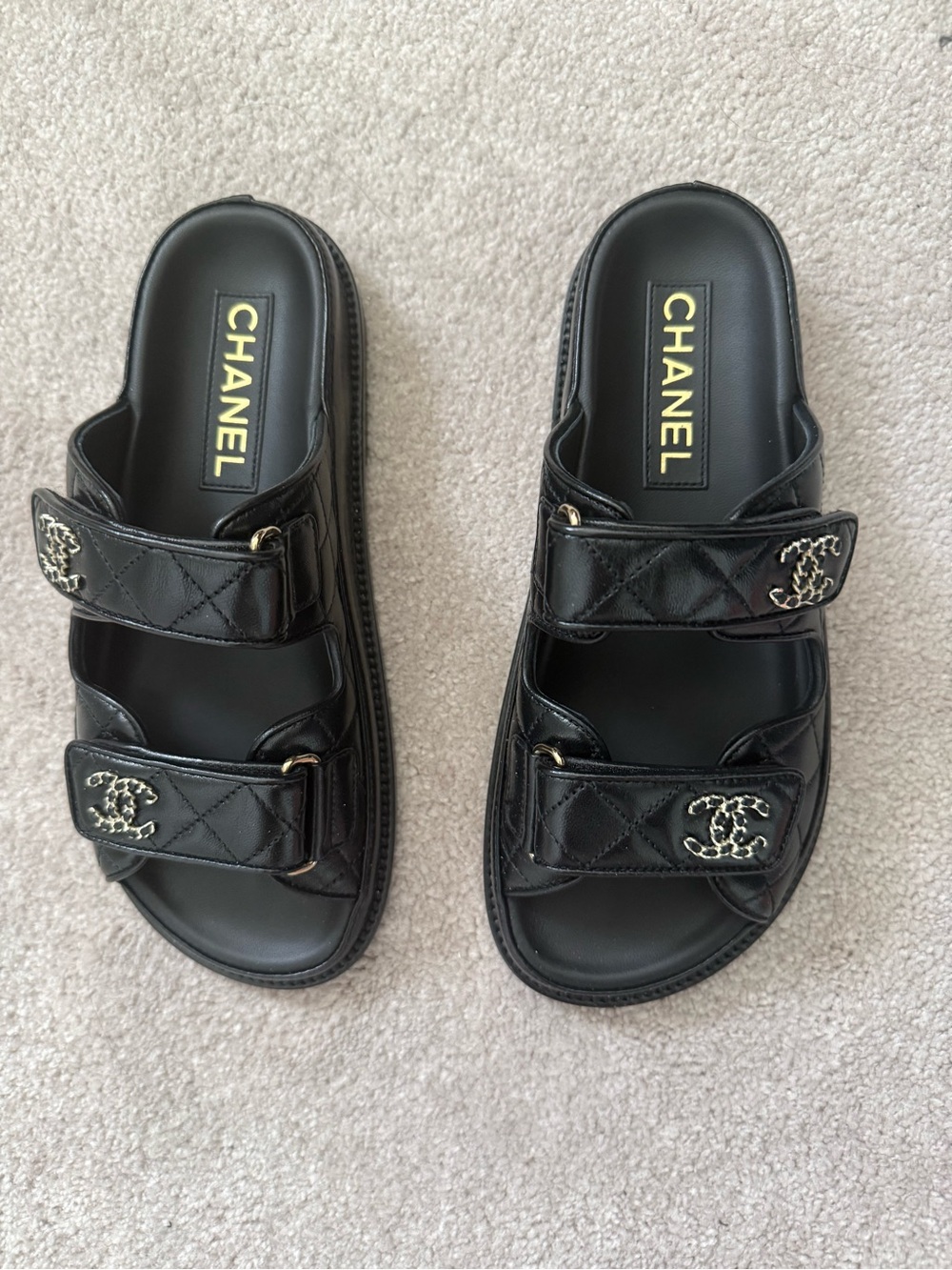 CHANEL Black Quilted Slide Sandals with Gold Logo Detail